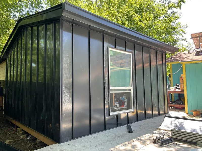 Black standing seam metal wall panels for Roof Inspection in Murphy